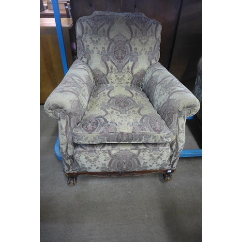 215 - A pair of early 20th Century Chippendale Revival carved mahogany and fabric upholstered armchairs