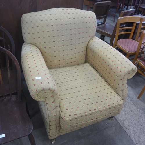 220 - A Victorian style fabric upholstered armchair