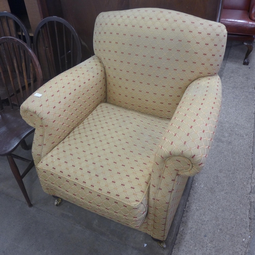 220 - A Victorian style fabric upholstered armchair