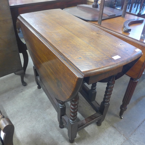 231 - An oak barleytwist gateleg table