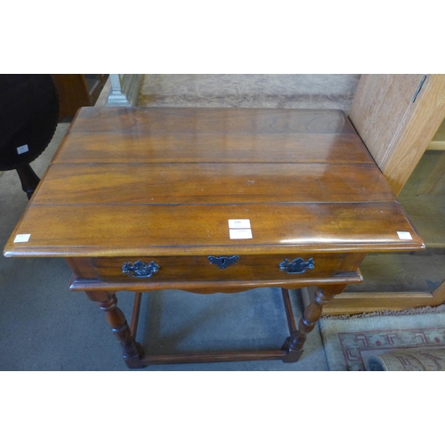 240 - An 18th Century style hardwood single drawer side table