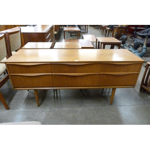 26 - An Austin Suite teak six drawer sideboard