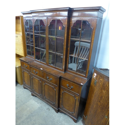 264 - A Regency style mahogany breakfront secretaire bookcase