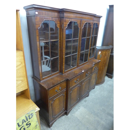 264 - A Regency style mahogany breakfront secretaire bookcase