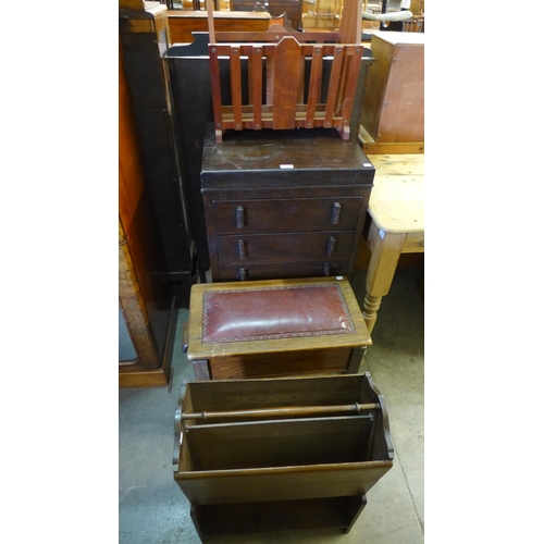 268 - An Art Deco beech chest of drawers, two magazine racks and a walnut piano stool