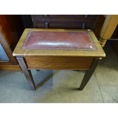 268 - An Art Deco beech chest of drawers, two magazine racks and a walnut piano stool