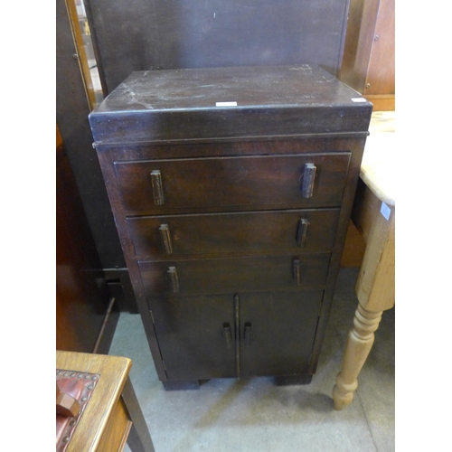 268 - An Art Deco beech chest of drawers, two magazine racks and a walnut piano stool