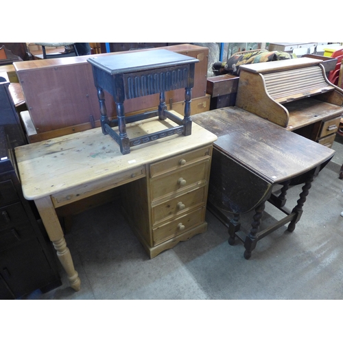 269 - An oak barleytwist gateleg table, a pine desk and a carved oak occasional table