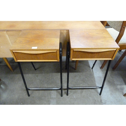 29 - A pair of Austin Suite teak and black steel bedside tables