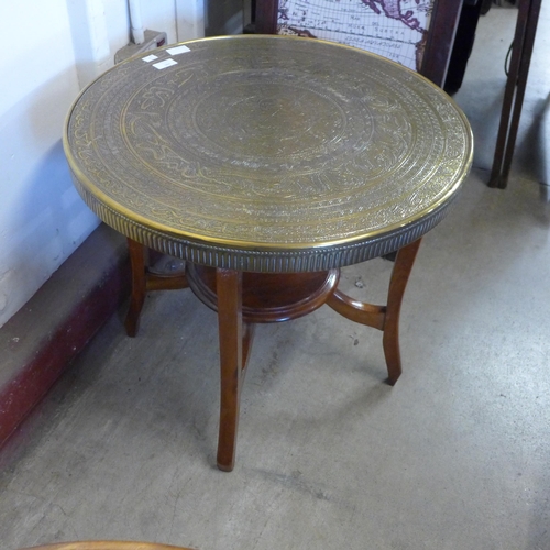 290 - A stained pine open bookcase, an Islamic brass topped coffee table and one other