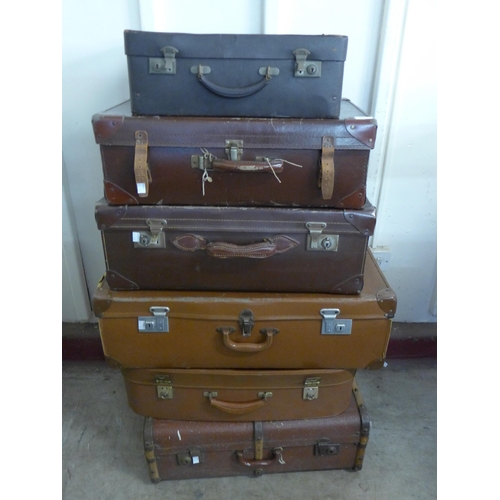 291 - Six vintage suitcases