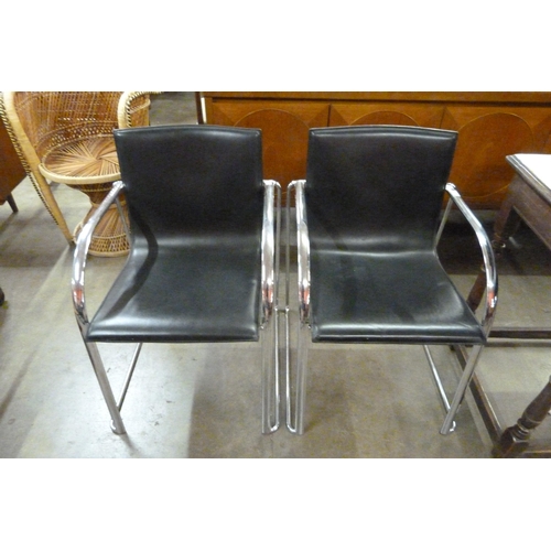 35 - A pair of Italian chrome and black vinyl armchairs