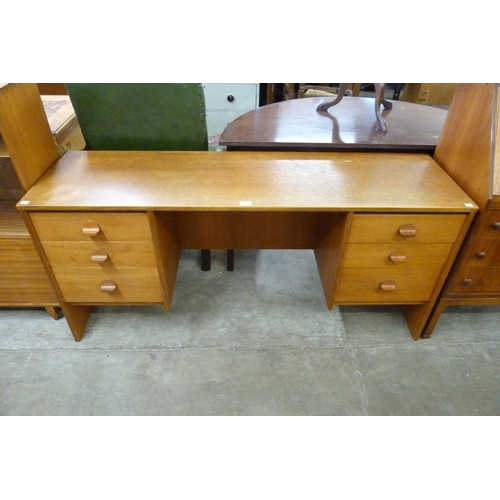 44 - A Stag Cantata teak desk, designed by John & Sylvia Reid