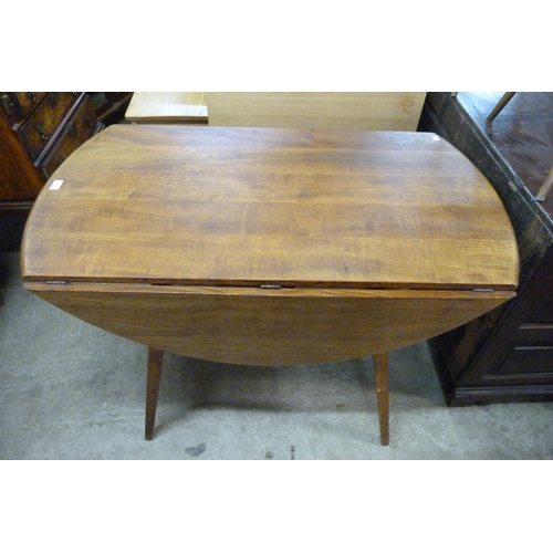 59 - An Ercol elm and beech Windsor drop-leaf table