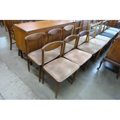 61 - A Danish teak drop leaf dining table and six chairs