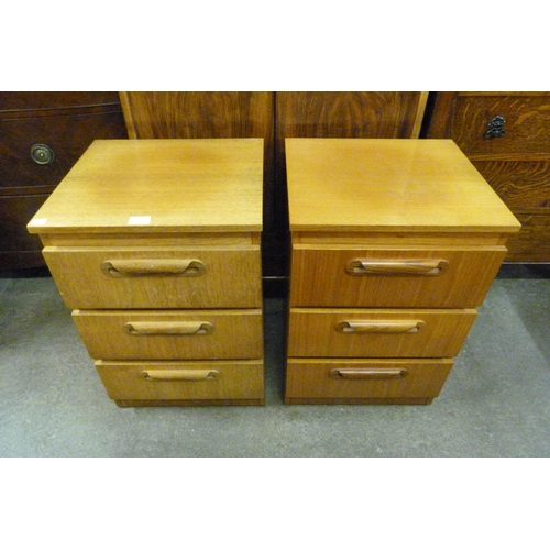 65 - A pair of teak bedside chests