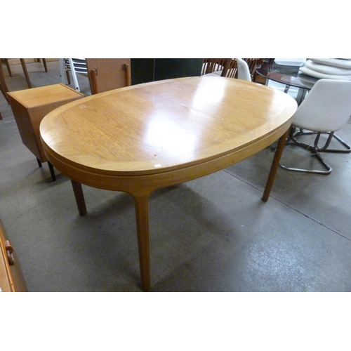 73 - A Nathan teak extending dining table