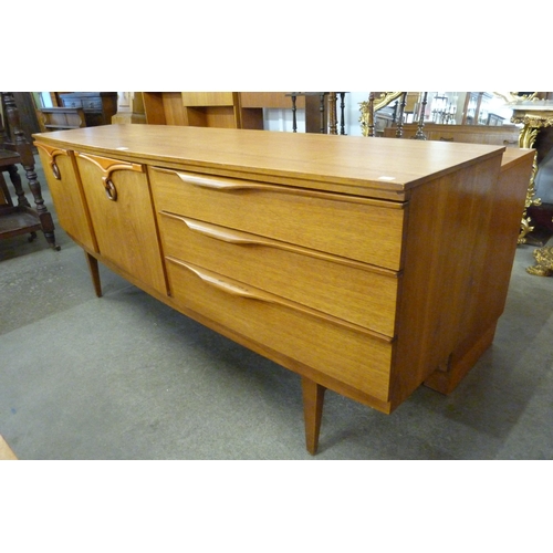 74 - A Beautility teak sideboard