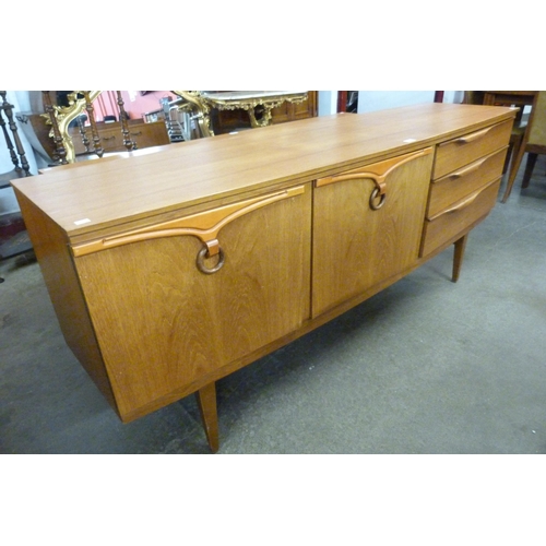 74 - A Beautility teak sideboard