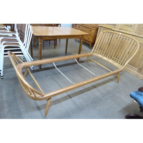 83 - An Ercol Blonde beech single bed