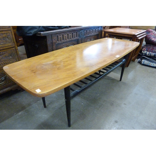 94 - A walnut and black coffee table