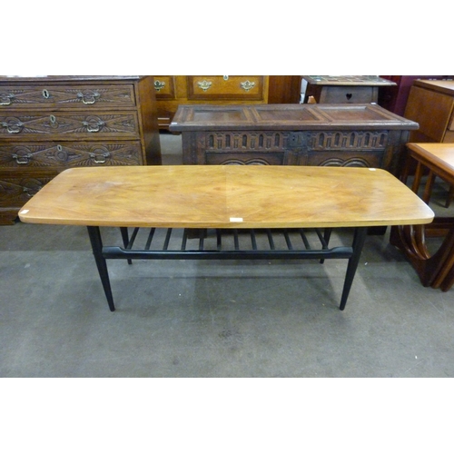 94 - A walnut and black coffee table