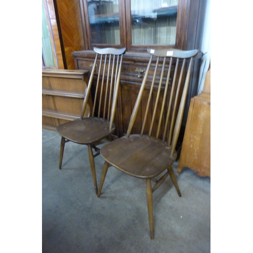 95 - A pair of Ercol Golden Dawn elm and beech Goldsmith chairs and a plate rack