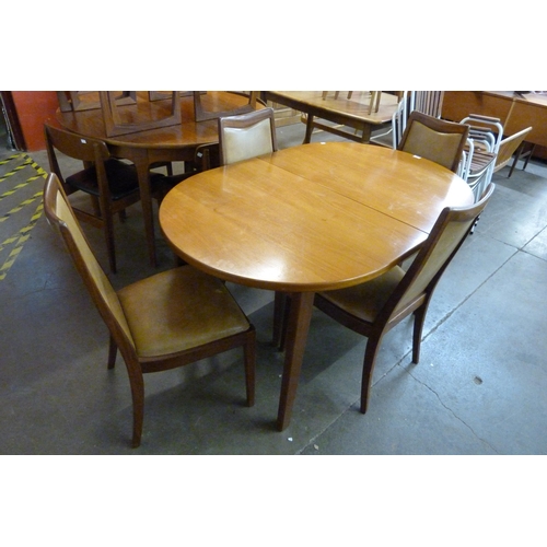 96 - A G-Plan teak extending dining table and four chairs