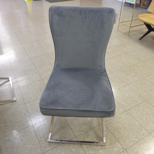 1301 - A grey ceramic top dining table with a set of six Hugo dark grey velvet dining chairs  *This lot is ... 