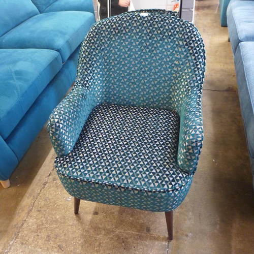 1426 - A teal geometric patterned side chair