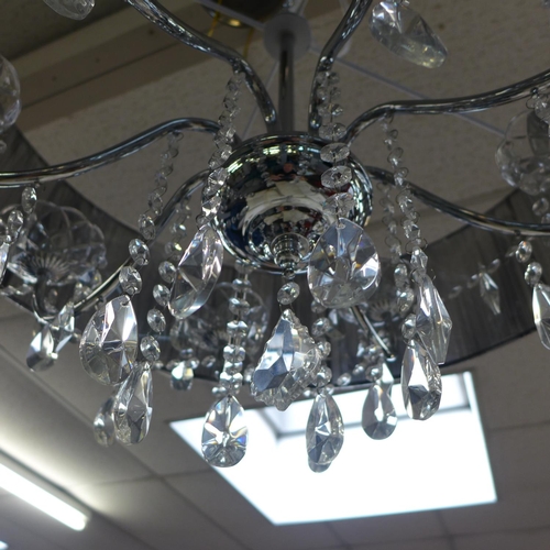 1462 - A chrome 8-armed chandelier with black shade