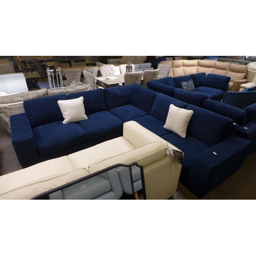 1481 - A large blue velvet six seater loft corner sofa on wooden base