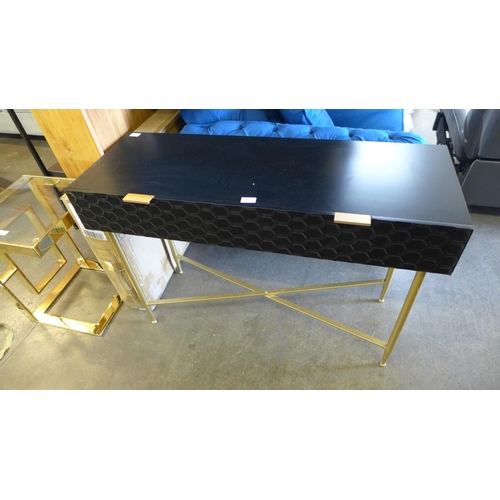 1532 - A black console table with gold legs