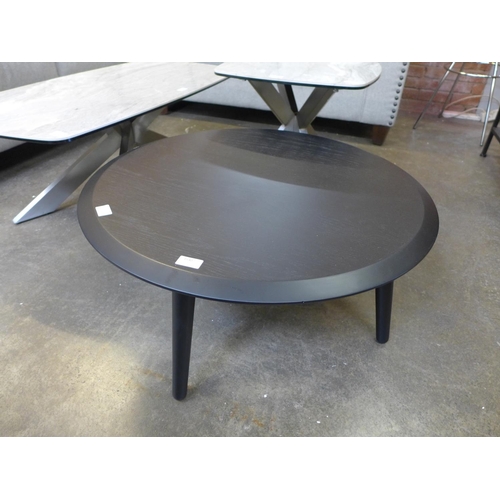 1540 - A black circular coffee table * this lot is subject to VAT