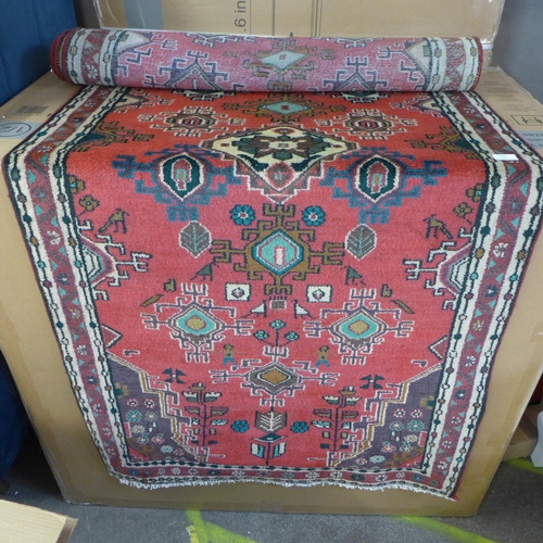 1544 - A fine hand woven Persian village runner with bespoke all over design, 290cm x 92cm