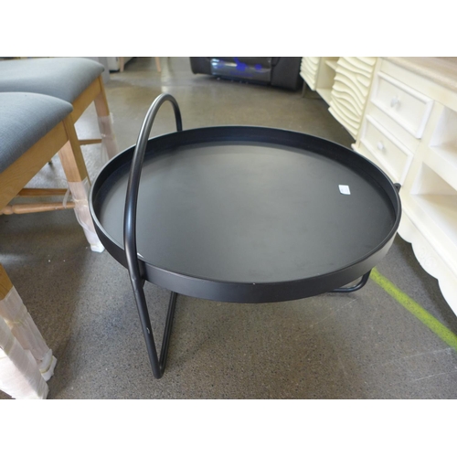 1553 - A black circular coffee table in an industrial style * this lot is subject to VAT