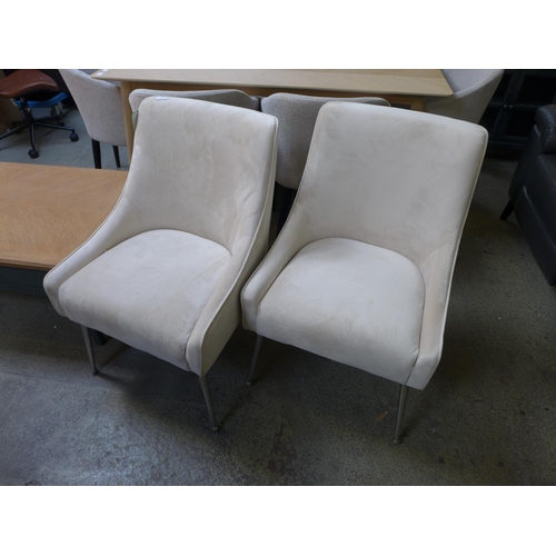 1559 - A pair of cream plush velvet side/dining chairs with chrome legs * this lot is subject to VAT