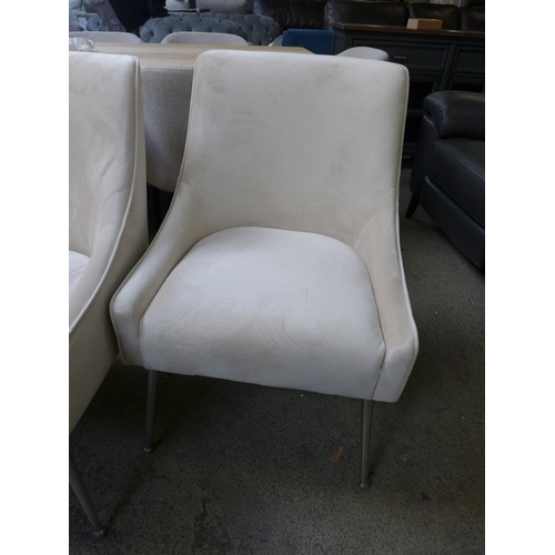 1559 - A pair of cream plush velvet side/dining chairs with chrome legs * this lot is subject to VAT