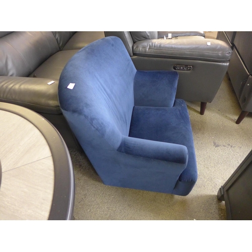 1562 - A deep blue velvet armchair - missing feet