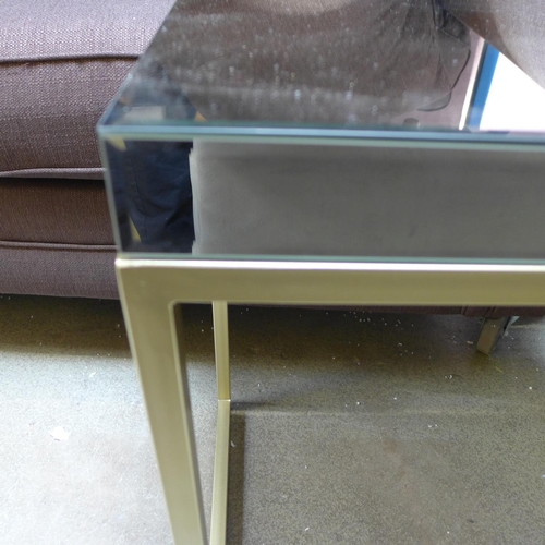 1574 - A mirrored side table with gold base * this lot is subject to VAT