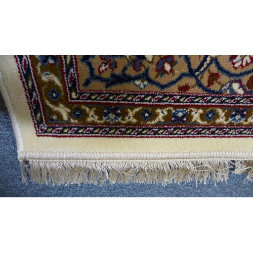 1582 - A cream full pile Cashmere rug with central Shabass medallion design, 230cm x 160cm