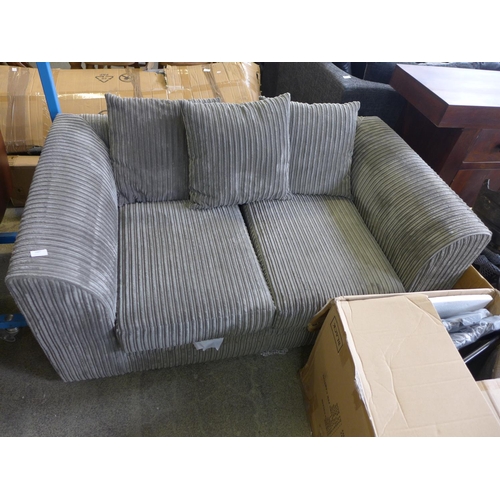 1607 - A grey jumbo corduroy two seater sofa