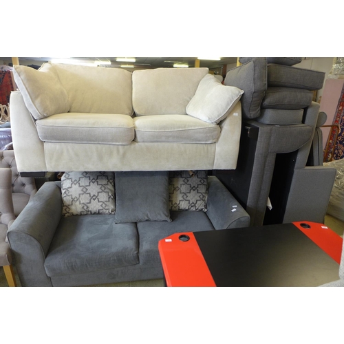 1628 - A grey velvet three seater sofa with patterned cushions, a cream upholstered sofa and sofa parts