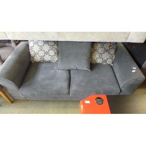 1628 - A grey velvet three seater sofa with patterned cushions, a cream upholstered sofa and sofa parts