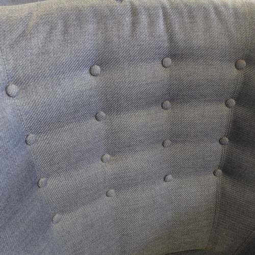 1629 - A blue upholstered button back wing armchair