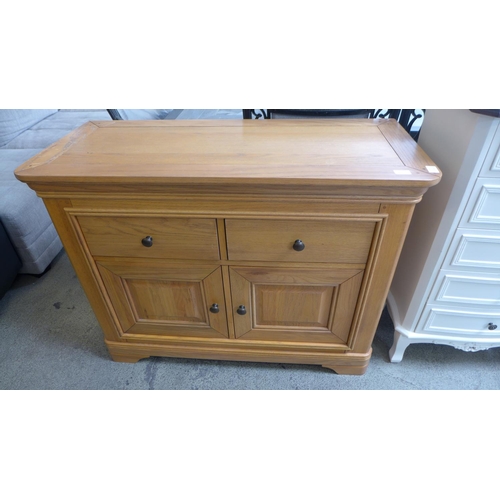 1665 - An oak two door, two drawer sideboard