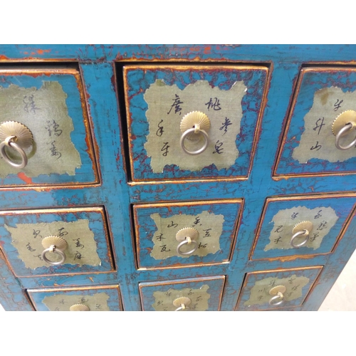 1666 - An oriental style multi drawer chest - damaged side