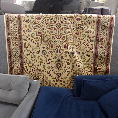 1444 - A cream and red ground full pile Cashmere carpet with central medallion design, 300cm x 200cm