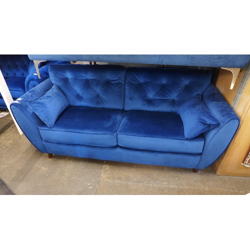 1491 - A Moxton blue velvet three seater button back sofa