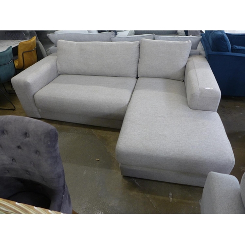 1503 - A grey textured weave four seater sofa/chaise